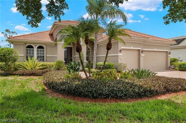 mediterranean / spanish-style house featuring a garage