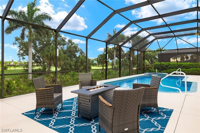 view of swimming pool featuring glass enclosure, a patio, and an outdoor fire pit