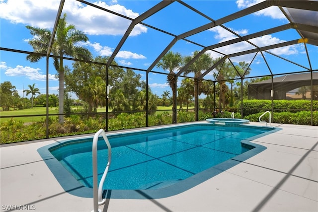 view of swimming pool with a lanai and a patio