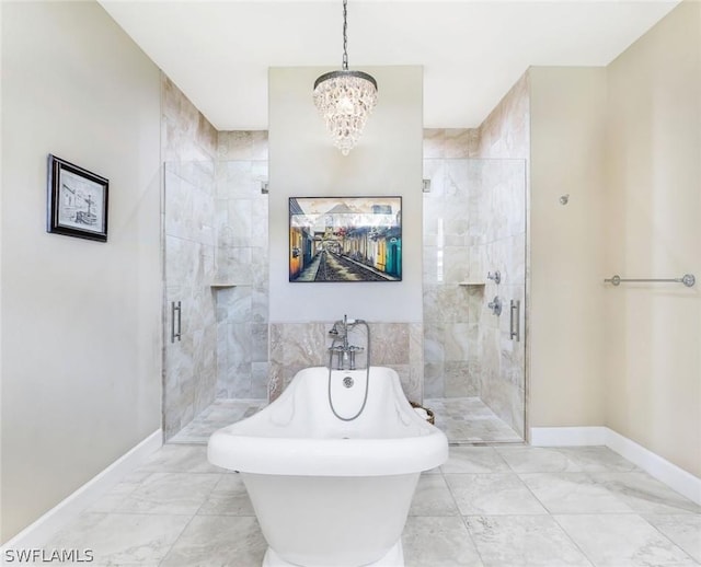 bathroom featuring a chandelier and plus walk in shower