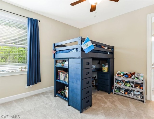 bedroom with ceiling fan and carpet