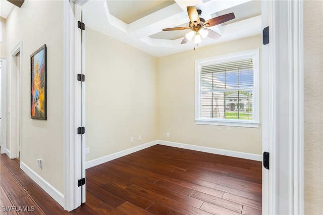 unfurnished room featuring dark wood-type flooring and ceiling fan