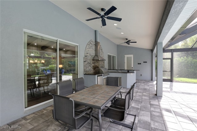 view of patio / terrace with ceiling fan, an outdoor kitchen, a grill, and a lanai