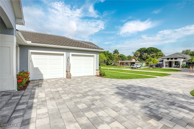 garage featuring a yard