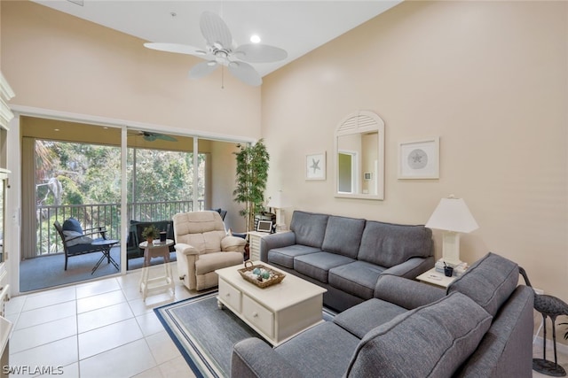 living room with ceiling fan, light tile patterned flooring, and high vaulted ceiling