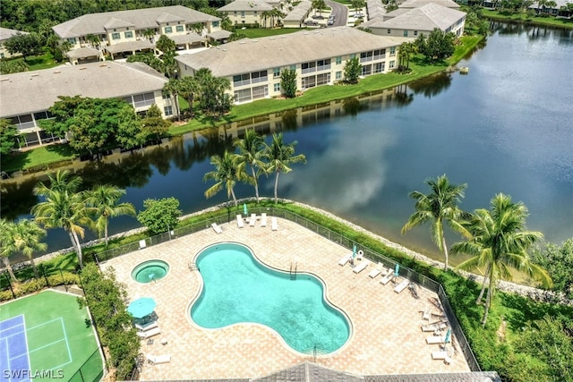 view of swimming pool with a water view