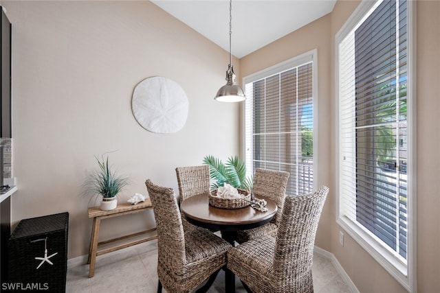 dining area with lofted ceiling