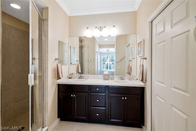 bathroom featuring tile patterned floors, vanity, an enclosed shower, and crown molding