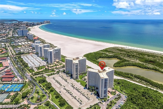 aerial view featuring a view of the beach and a water view