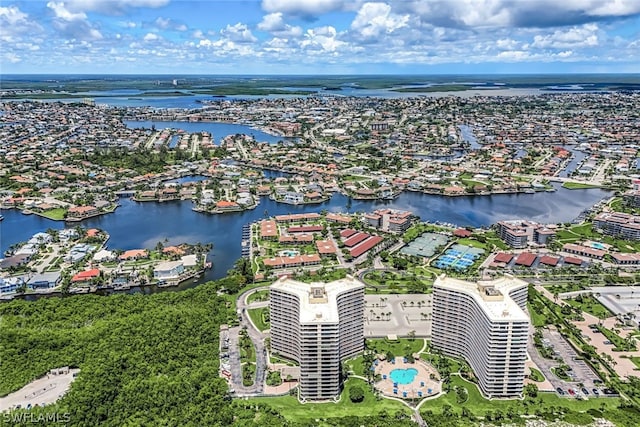 birds eye view of property with a water view