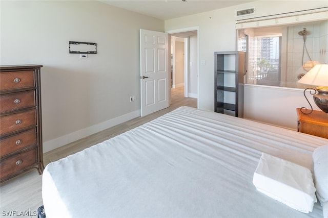 bedroom featuring light hardwood / wood-style floors