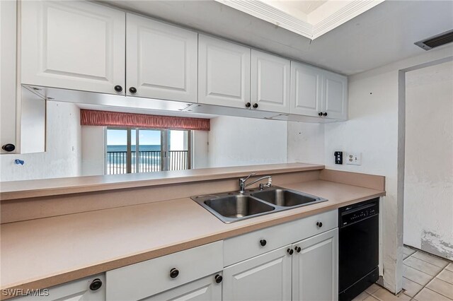 kitchen with light tile patterned floors, black dishwasher, white cabinetry, and sink