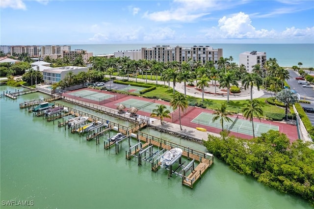 birds eye view of property with a water view and a city view