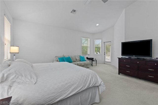 bedroom with vaulted ceiling, light colored carpet, access to exterior, and ceiling fan