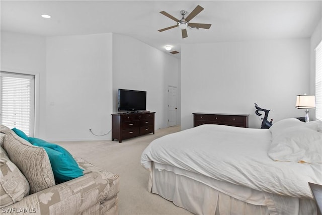 bedroom with light colored carpet and ceiling fan