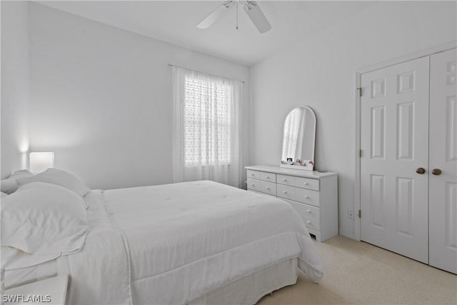 bedroom with light colored carpet and ceiling fan