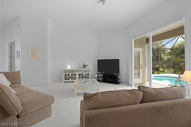 living room featuring carpet and plenty of natural light