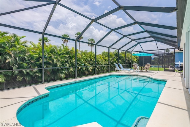 view of pool featuring a lanai and a patio area