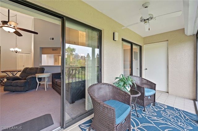 balcony featuring a patio area and ceiling fan