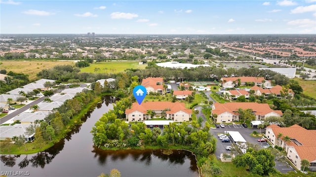 drone / aerial view featuring a water view