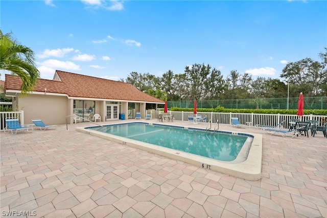 view of pool featuring a patio