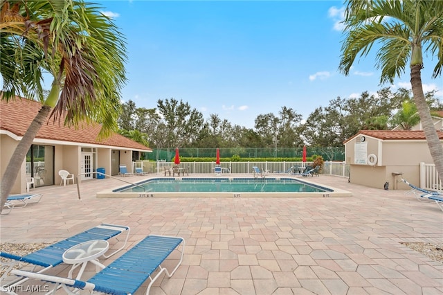 view of swimming pool featuring a patio area