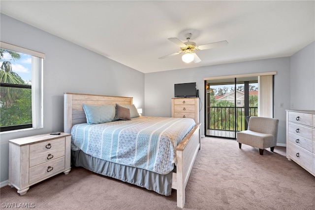 carpeted bedroom featuring access to outside and ceiling fan