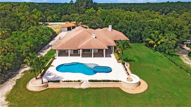 view of swimming pool with a yard and a patio area