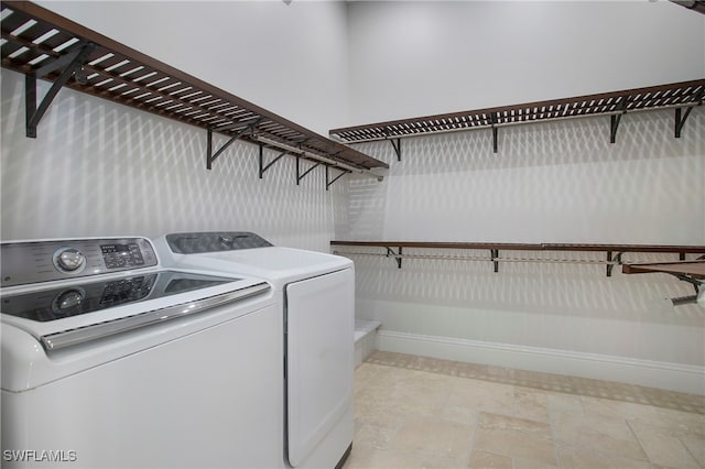 clothes washing area featuring washer and dryer