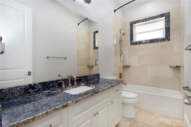 full bathroom with toilet, tiled shower / bath combo, and vanity