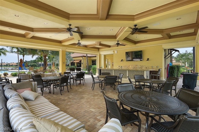 view of patio / terrace with ceiling fan and outdoor lounge area