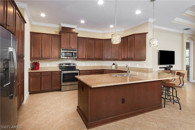 kitchen featuring ornamental molding, light tile patterned flooring, pendant lighting, and stainless steel appliances