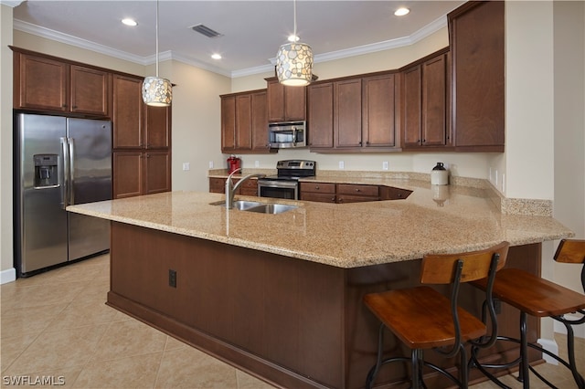 kitchen featuring hanging light fixtures, ornamental molding, sink, appliances with stainless steel finishes, and kitchen peninsula