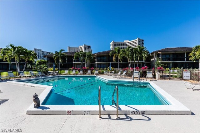 view of swimming pool featuring a patio