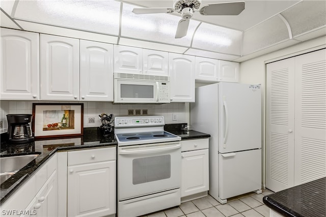 kitchen featuring tasteful backsplash, ceiling fan, light tile patterned floors, white appliances, and white cabinets