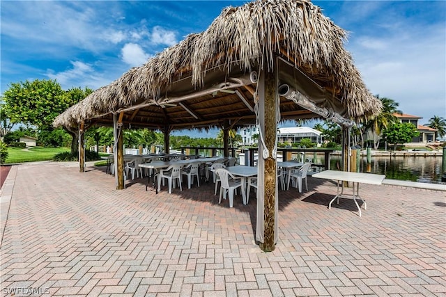 view of home's community featuring a gazebo and a water view