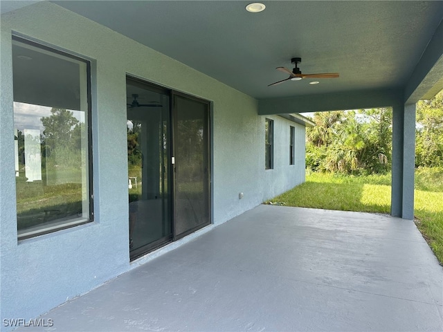 view of patio / terrace featuring ceiling fan