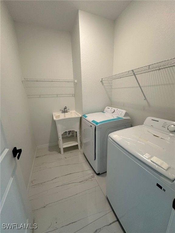 laundry room featuring sink and independent washer and dryer