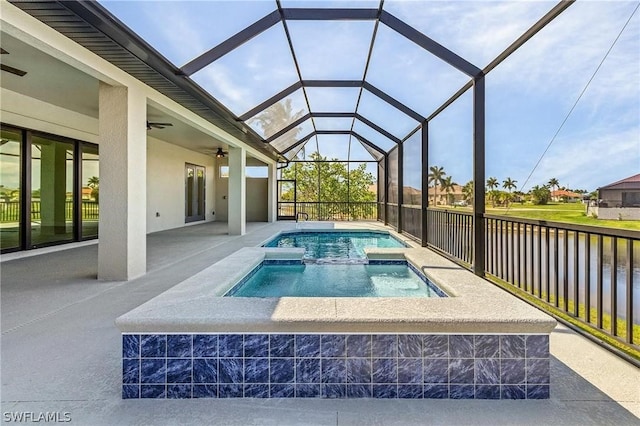 view of swimming pool with an in ground hot tub, a patio, ceiling fan, and a lanai