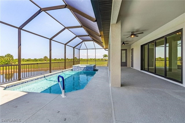 view of pool with an in ground hot tub, ceiling fan, a patio area, and a lanai