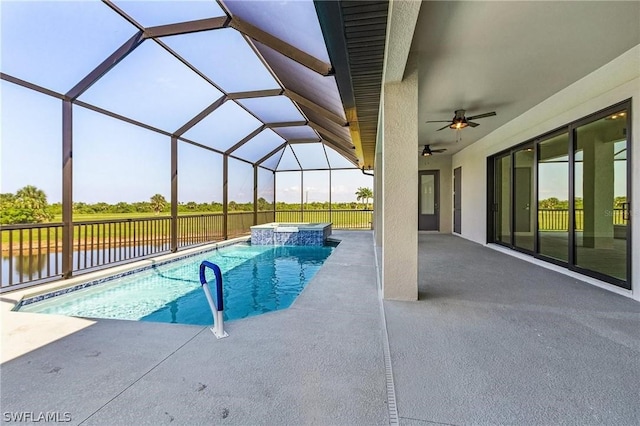 view of swimming pool with a patio, an in ground hot tub, ceiling fan, glass enclosure, and a water view