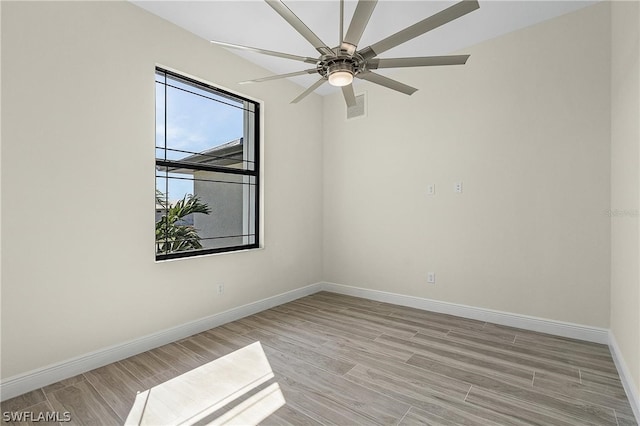 spare room with ceiling fan and light hardwood / wood-style floors