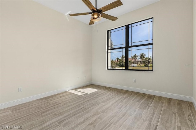 unfurnished room with ceiling fan and light wood-type flooring