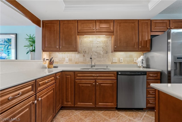 kitchen featuring sink, tasteful backsplash, a raised ceiling, and stainless steel appliances