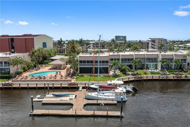 view of dock featuring a patio area and a water view