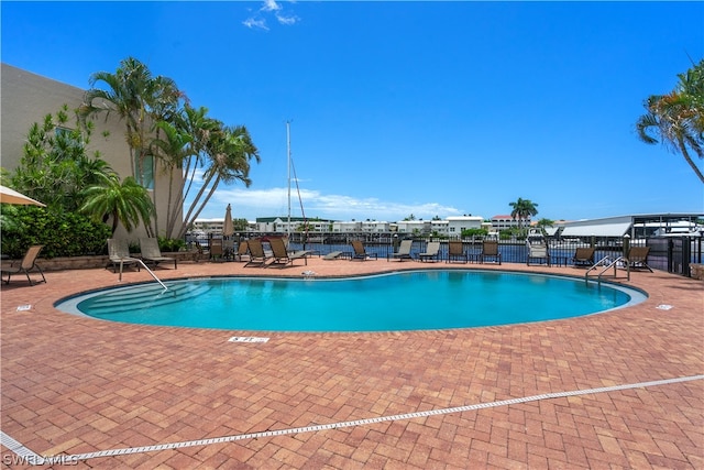 view of swimming pool featuring a patio area