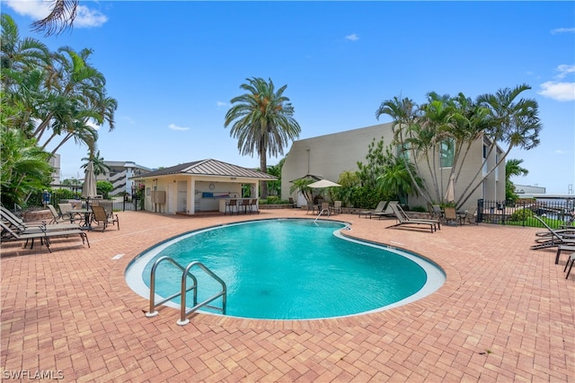 view of pool featuring a patio