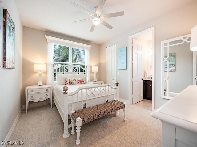 carpeted bedroom featuring connected bathroom and ceiling fan