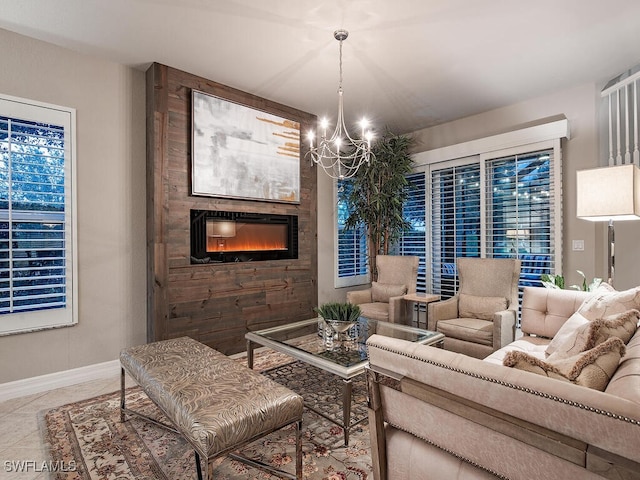 living room featuring tile patterned flooring, a large fireplace, and a chandelier