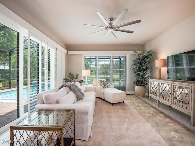 sunroom / solarium with ceiling fan